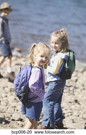 Young girls with backpacks. View Large Photo Image Stock Image - Young girls with backpacks.. Fotosearch