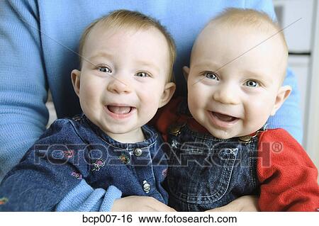 Close-up of twin babies. View Large Photo Image Stock Photograph - Close-up of twin babies.. Fotosearch