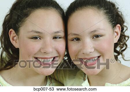 Close-up portrait of twin teenage girls. View Large Photo Image Stock Image - Close-up portrait of twin teenage girls.. Fotosearch