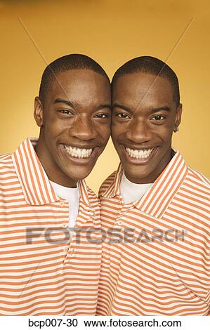 Studio portrait of twin teen boys. View Large Photo Image Stock Image - Studio portrait of twin teen boys.. Fotosearch