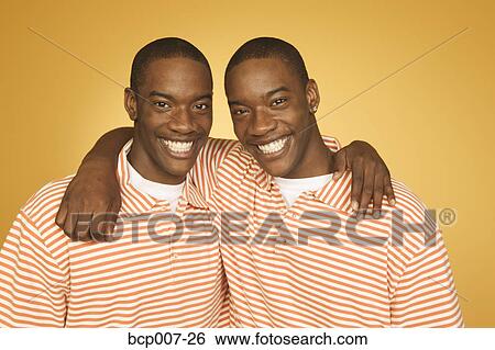Studio portrait of twin teenage boys. View Large Photo Image Stock Photograph - Studio portrait of twin teenage boys.. Fotosearch