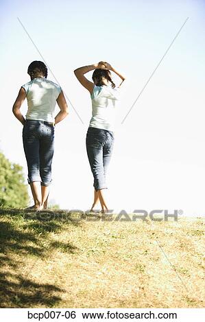 Teenage twins waling up a hill. View Large Photo Image Stock Photograph - Teenage twins waling up a hill.. Fotosearch