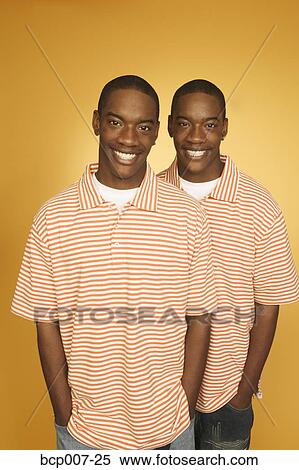 Twin teen boys in matching shirts. View Large Photo Image Stock Photography - Twin teen boys in matching shirts.. Fotosearch