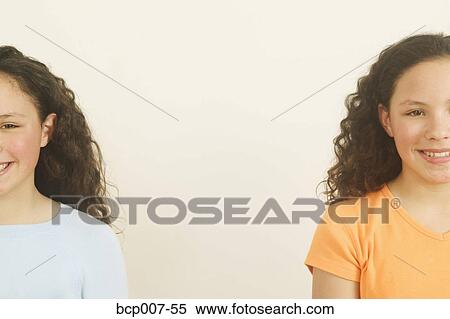 Stock Photography - Twin teenage girls.. Fotosearch