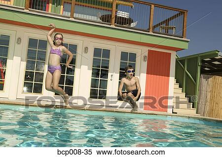 Children jumping into a swimming pool. View Large Photo Image Stock Photography - Children jumping into a swimming pool.. Fotosearch