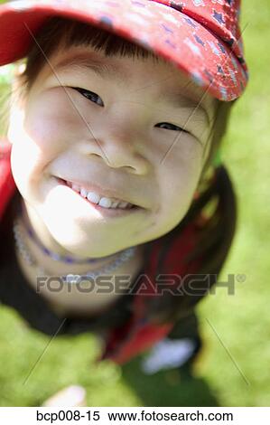 Stock Photography - Closeup of a young girl outdoors.. Fotosearch