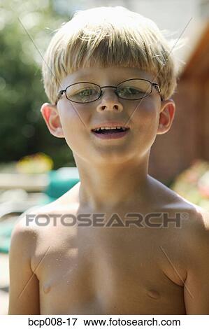Portrait of a young boy with glasses. View Large Photo Image Stock Photo - Portrait of a young boy with glasses.. Fotosearch