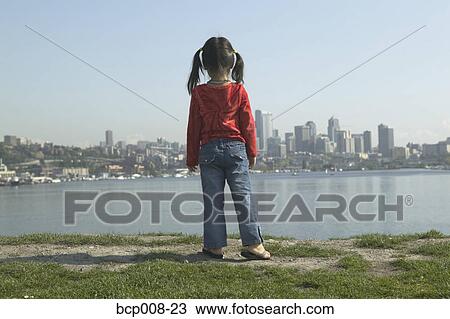 Young girl gazing at the Seattle skyline. View Large Photo Image Stock Image - Young girl gazing at the Seattle skyline.. Fotosearch