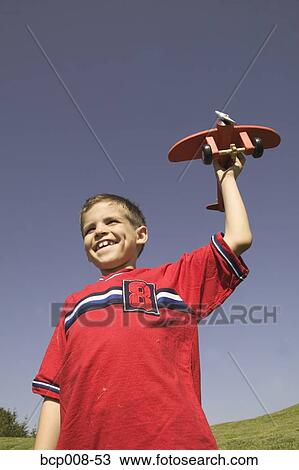 Young launching a model airplane. View Large Photo Image Stock Image - Young launching a model airplane.. Fotosearch