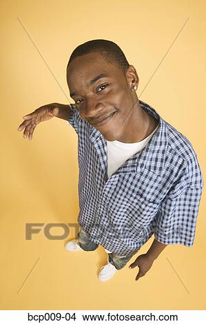 Portrait of a teenage boy in studio. View Large Photo Image Picture - Portrait of a teenage boy in studio.. Fotosearch