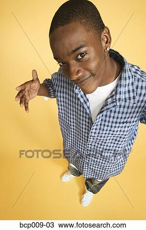 Portrait of a teenage boy in studio. View Large Photo Image Stock Image - Portrait of a teenage boy in studio.. Fotosearch