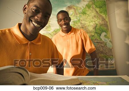 Portrait of twin teenage brothers in a classroom. View Large Photo Image Stock Photograph - Portrait of twin teenage brothers in a classroom.. Fotosearch