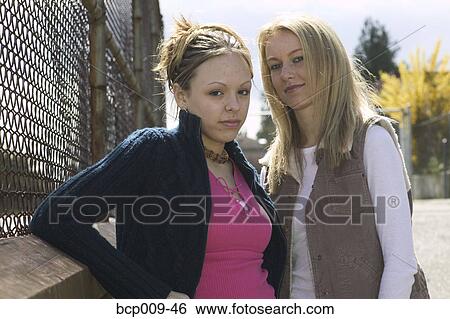 Stock Photograph - Portrait of two teenage girls.. Fotosearch