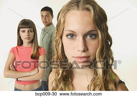 Studio portrait of three teens. View Large Photo Image Stock Image - Studio portrait of three teens.. Fotosearch