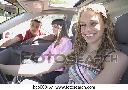 Teenage girls in a car and their friend. View Large Photo Image Stock Photo - Teenage girls in a car and their friend.. Fotosearch