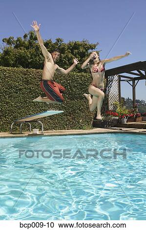 Teenagers getting crazy in a swimming pool. View Large Photo Image Stock Image - Teenagers getting crazy in a swimming pool.. Fotosearch