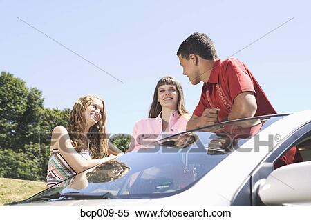 Three teenage friends hanging out. View Large Photo Image Stock Photography - Three teenage friends hanging out.. Fotosearch