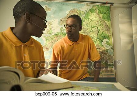 Twin teenage brothers in a classroom. View Large Photo Image Stock Photography - Twin teenage brothers in a classroom.. Fotosearch