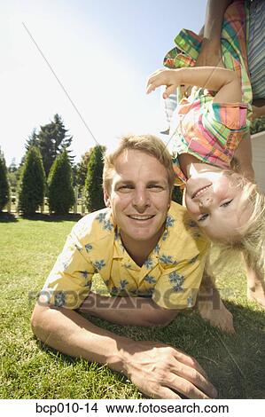 Informal portrait of father and young daughter outside. View Large Photo Image Picture - Informal portrait of father and young daughter outside.. Fotosearch