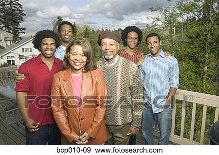 Outdoor family portrait: mother, father and four grown sons. View Large Photo Image Stock Photo - Outdoor family portrait: mother, father and four grown sons.. Fotosearch