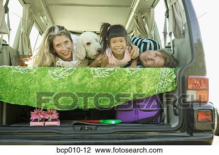 Parents, daughter and their dog in a van. View Large Photo Image Stock Image - Parents, daughter and their dog in a van.. Fotosearch