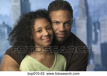 Portrait of a father with his teenaged daughter. View Large Photo Image Stock Image - Portrait of a father with his teenaged daughter.. Fotosearch