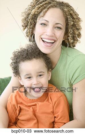 Stock Image - Portrait of a mother and her young son.. Fotosearch