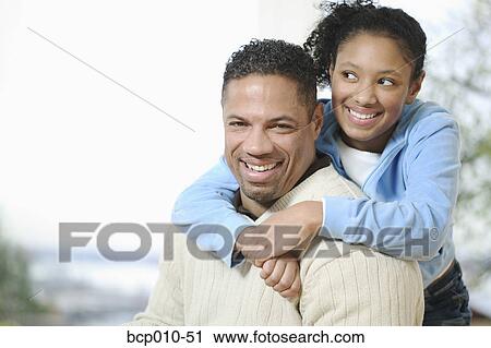 Teenage girl gives her father a hug. View Large Photo Image Stock Image - Teenage girl gives her father a hug.. Fotosearch