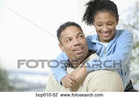 Teenage girl gives her father a hug. View Large Photo Image Stock Image - Teenage girl gives her father a hug.. Fotosearch