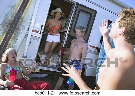 Group of young people with surfboards at a motor home. View Large Photo Image Stock Image - Group of young people with surfboards at a motor home.. Fotosearch
