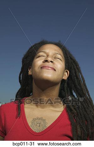 Stock Image - Portrait of a young woman.. Fotosearch