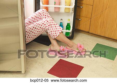 Woman sitting in an open refrigerator. View Large Photo Image Stock Photography - Woman sitting in an open refrigerator.. Fotosearch