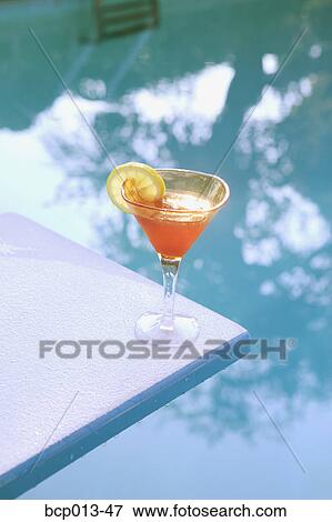Stock Photo - A cocktail on a diving board. . Fotosearch