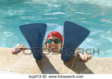 A woman's face between swim fins. View Large Photo Image Stock Image - A woman's face between swim fins.. Fotosearch