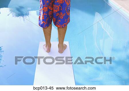 Man's legs on a diving board. View Large Photo Image Stock Photography - Man's legs on a diving board. . Fotosearch