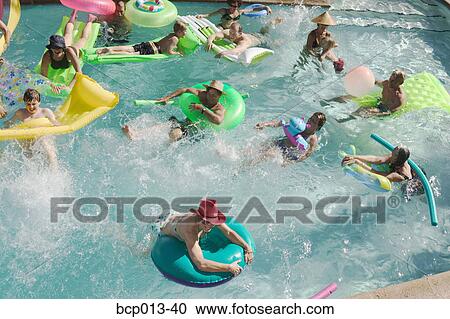 Overhead view of a pool party. View Large Photo Image Stock Image - Overhead view of a pool party.. Fotosearch