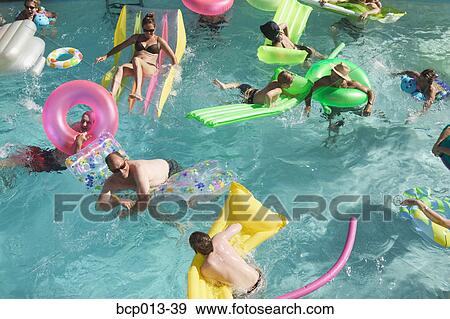 Overhead view of a pool party. View Large Photo Image Stock Photo - Overhead view of a pool party.. Fotosearch