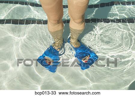Overhead view of feet in swim fins. View Large Photo Image Stock Image - Overhead view of feet in swim fins.. Fotosearch