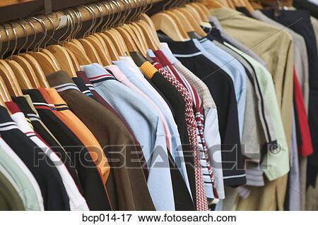 Clothes rack in a trendy boutique. View Large Photo Image Stock Photo - Clothes rack in a trendy boutique. . Fotosearch