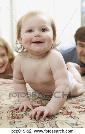 A baby crawling on the floor. View Large Photo Image Stock Image - A baby crawling on the floor.. Fotosearch