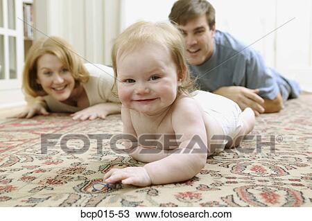 A baby crawling on the floor. View Large Photo Image Stock Image - A baby crawling on the floor.. Fotosearch