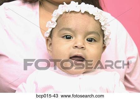 A baby girl with her mother. View Large Photo Image Stock Image - A baby girl with her mother.. Fotosearch