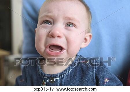 A crying baby girl. View Large Photo Image Stock Photo - A crying baby girl.. Fotosearch