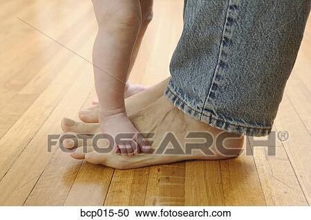 Father's and baby's bare feet. View Large Photo Image Stock Image - Father's and baby's bare feet. . Fotosearch