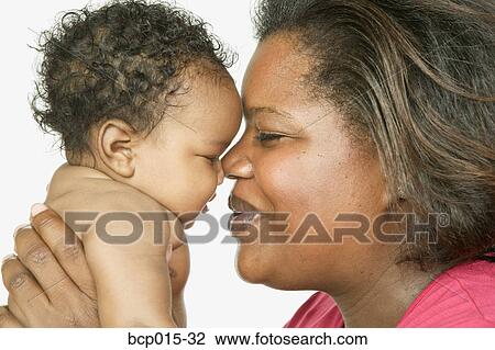 Overhead view of a baby girl on a white fur rug. View Large Photo Image Stock Image - Overhead view of a baby girl on a white fur rug. . Fotosearch