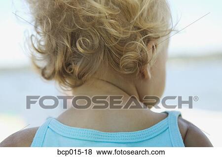 Rear view of a blonde baby girl's curls. View Large Photo Image Stock Photo - Rear view of a blonde baby girl's curls.. Fotosearch