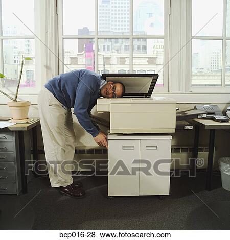 A man with his head in a copy machine. View Large Photo Image Stock Photo - A man with his head in a copy machine.. Fotosearch