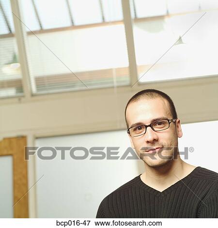 Stock Photo - Close-up office portrait of a young man. . Fotosearch