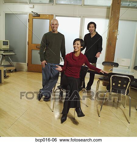 Stock Photograph - Group of three business colleagues.. Fotosearch