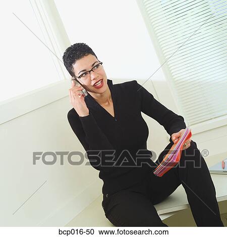 Office portrait of a woman talking on the phone. View Large Photo Image Stock Image - Office portrait of a woman talking on the phone.. Fotosearch